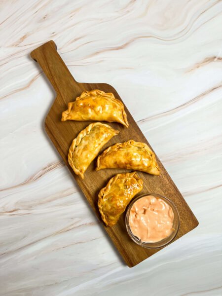 empanadas on a wooden board